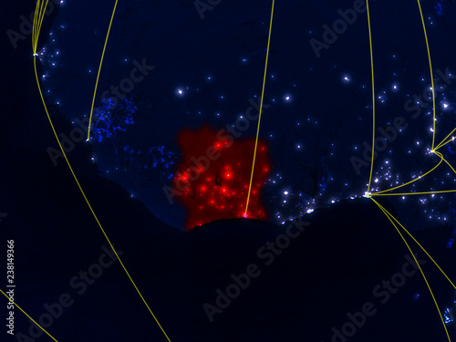 Ivory Coast from space on model of planet Earth at night with networks. Detailed planet surface with city lights. photo