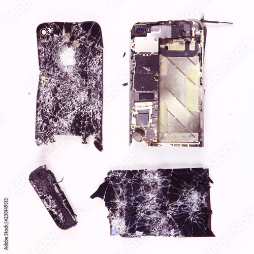 shattered, broken smartphone on white background