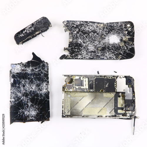 shattered, broken smartphone on white background