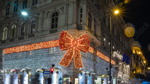 Christmas decorations with bright lighting and toys in front of National Opera Theater at the center of  Vienna.