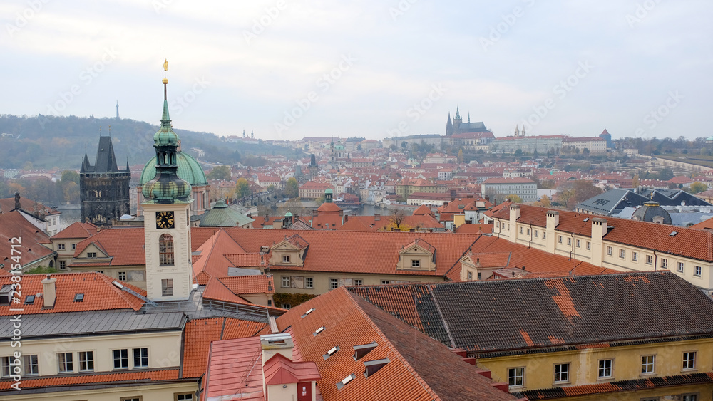 top view of the Prague city from astronomical tower with Prague castle background. Layers of red roof building, Czech republic