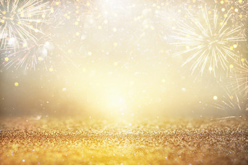 abstract gold glitter background with fireworks. christmas eve, new year and 4th of july holiday concept.