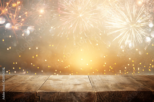 Empty wooden table in front of fireworks background. Product display montage.