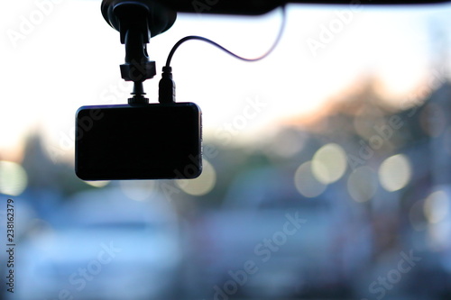 black video camera record technology on windscreen vehicle car driving