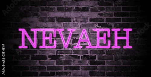first name Nevaeh in pink neon on brick wall