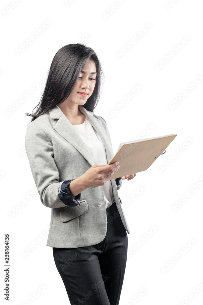 Smiling asian business woman reading the paperwork on clipboard Smiling asian business woman reading the paperwork on clipboard