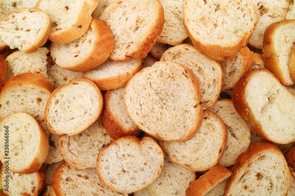 Texture of slices of light white wheat bread with splashes of dried onion Texture of slices of light white wheat bread with splashes of dried onion