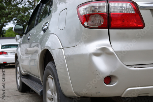 vehicle car bumper dent and taillight broken collision crash damage accident on road photo