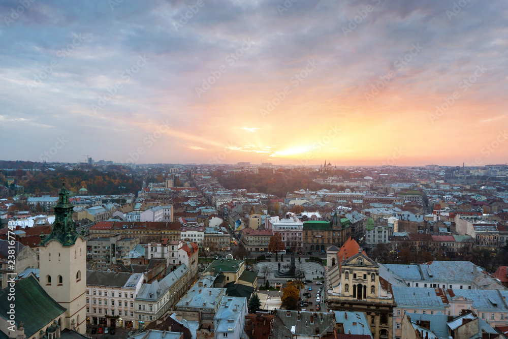 Naklejka premium Panoramic cityscape view on roofs,center and domes of Lviv city, Ukraine on sunset