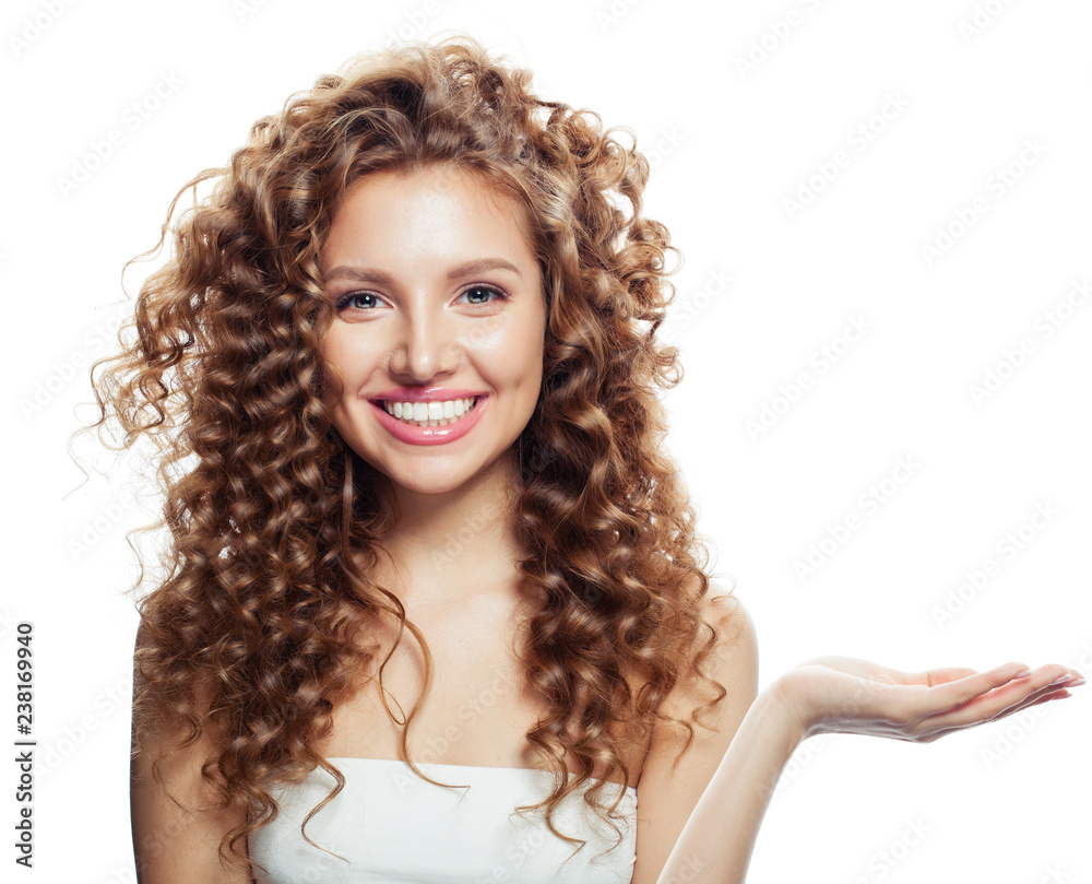 Cheerful woman showing open hand with empty copy space isolated on white. Expressive facial expressions.