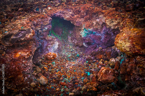 Bright multi-colored minerals on the slope of the volcano (Kamchatka, Russia) Rock formation after eruption.