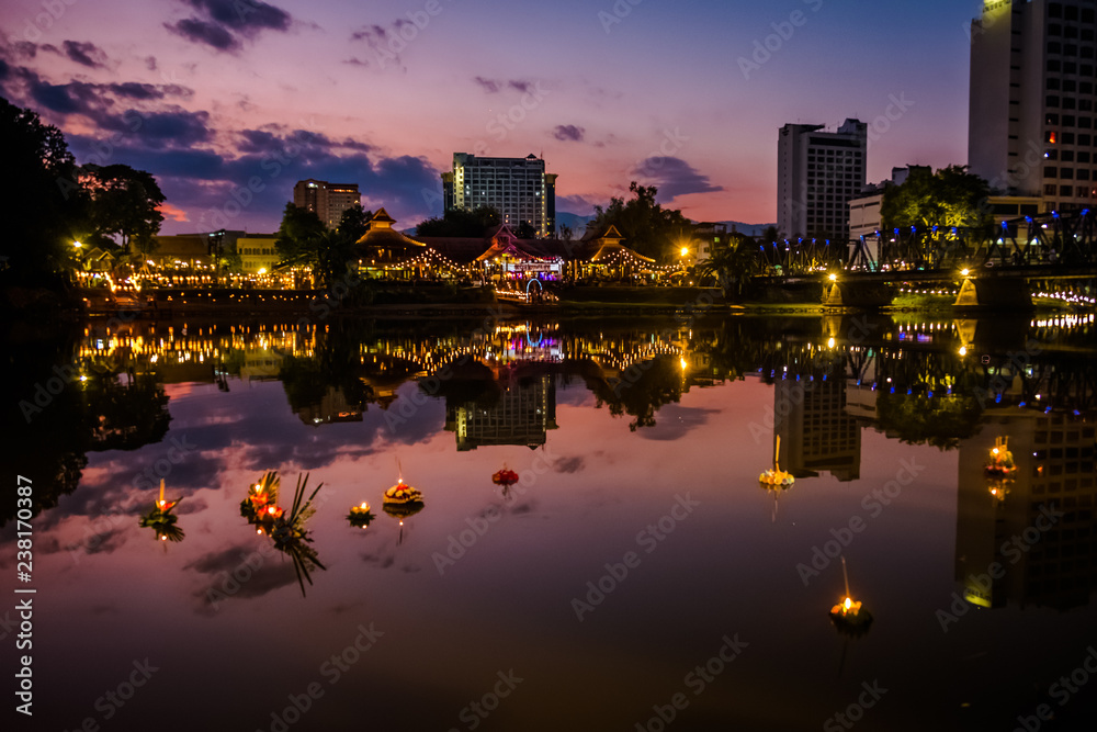 Flower baskets drifting on the river during Loi Krathong festival in Chiang Mai, Thailand