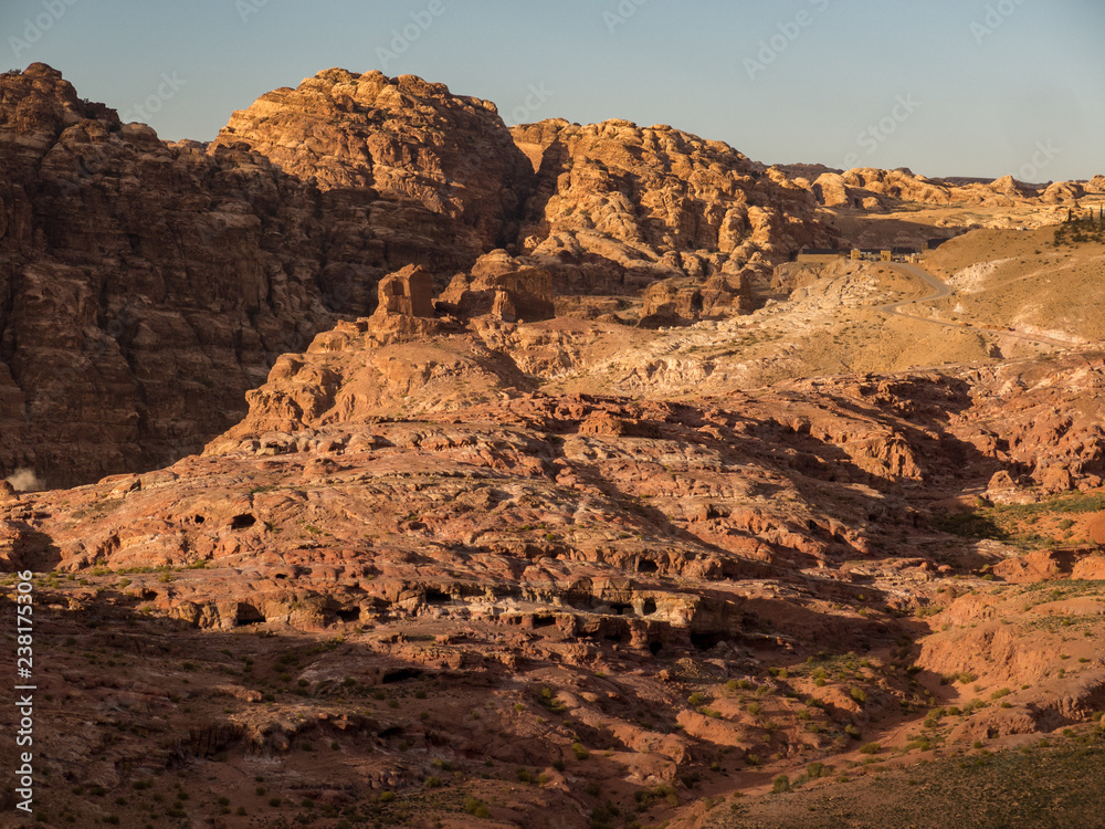 Landscape sunset view of Petra, Jordan with lots of burial caves