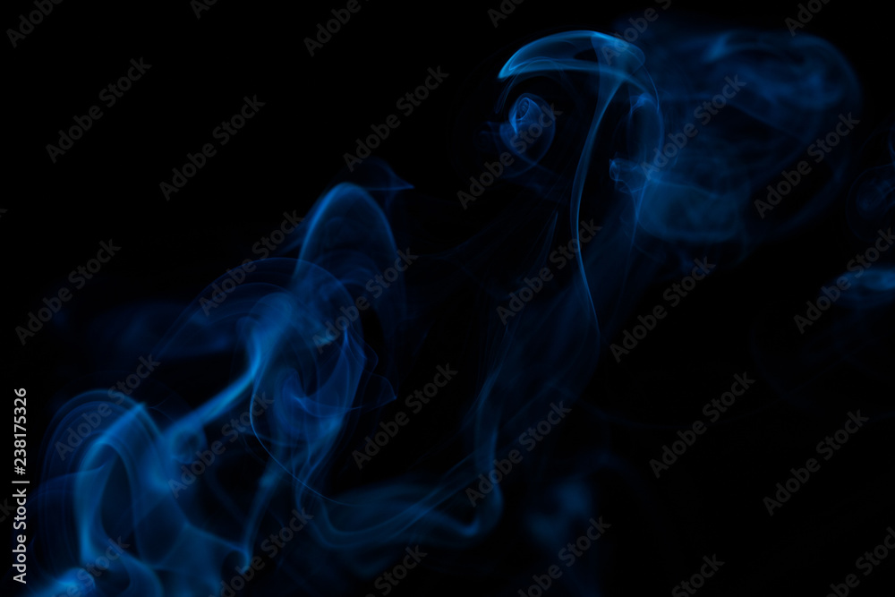Fototapeta premium Colorful smoke close-up on a black background