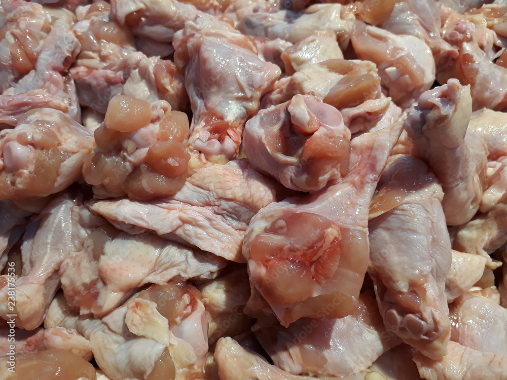 Piles of raw chicken drumstick in market Piles of raw chicken drumstick in market