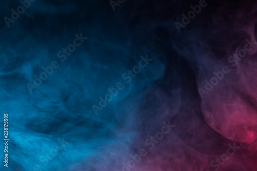 Colorful smoke close-up on a black background © vfhnb12