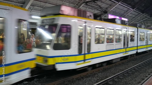 Manila Rail Transit Train and commuters photo
