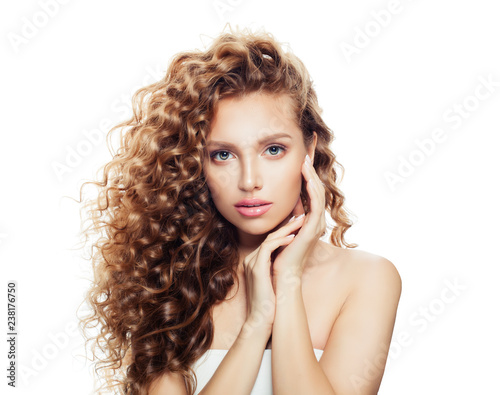 Healthy woman with clear skin and perfect curly hair isolated on white background. Spa beauty portrait