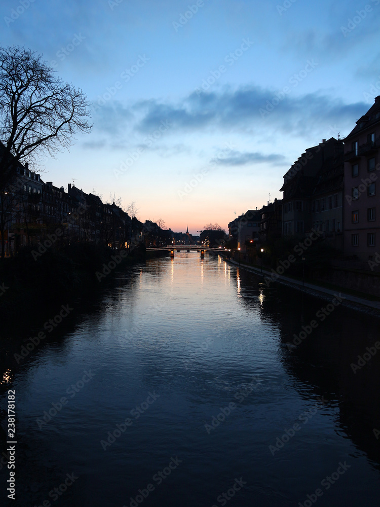 Naklejka premium winter evening sky reflected on the water - Strasbourg - France