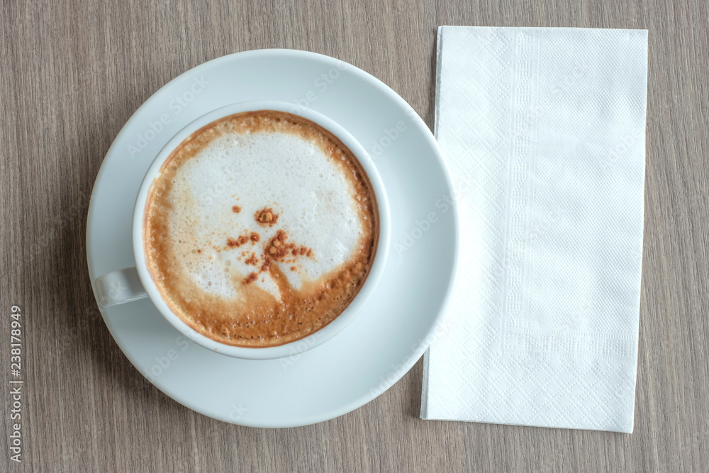 blank paper for your text with hot cappuccino coffee cup on table background at the morning xt blank paper for your text with hot cappuccino coffee cup on table background at the morning xt