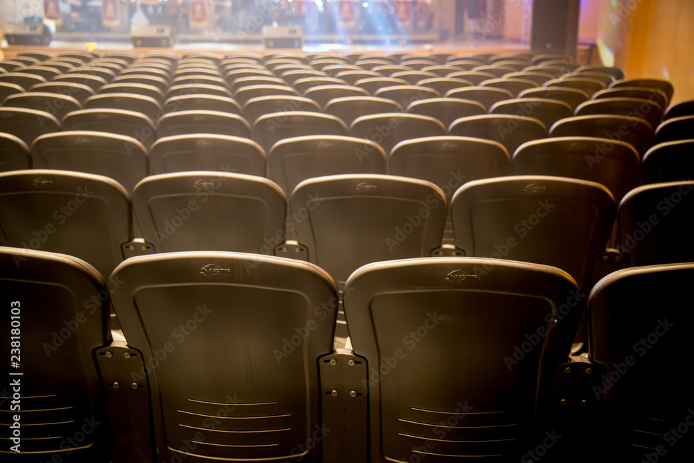 Fototapeta premium Empty comfortable chairs seats with numbers in hall