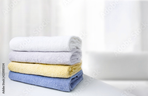 Stack of towels white room empty space background.