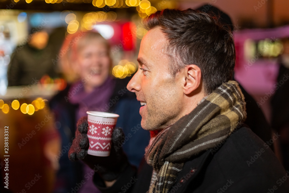 Portrait of man drinking mulled wine at Christmas market, Zagreb, Croatia. Portrait of man drinking mulled wine at Christmas market, Zagreb, Croatia.
