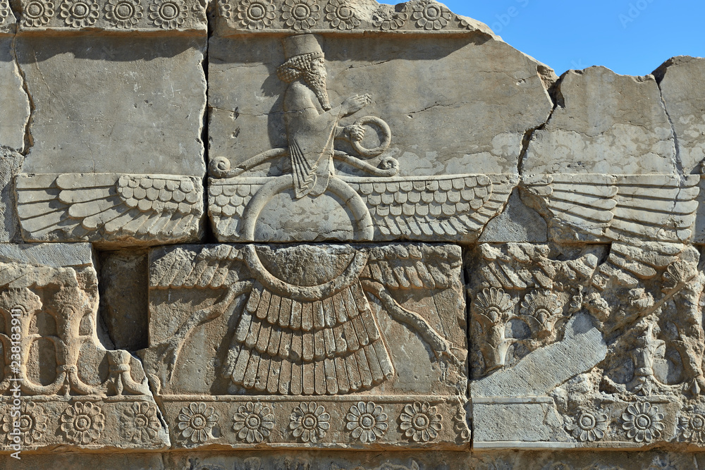 The beautiful reliefs symbols of Zoroastrian in the ruins of Ancient Persepolis Complex of