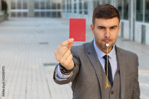 Obraz na plátne Businessman with whistle and red card