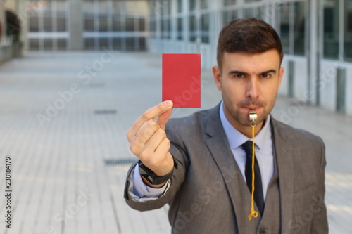Businessman punishing an employee with copy space photo