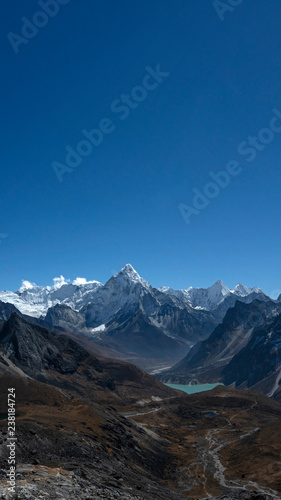 The iconic peak of Ama Dablam seen from the Everest three passes trek, after crossing Cho La high mountain pass. © Janos