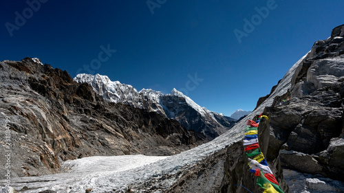 Below Cho La Pass is a glacier crossing along the Everest Three Passes trek. Prayer Flags are often seen flapping at the top of the high passes.
