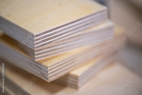 Close-up of plywood sheets at carpentry on wooden table