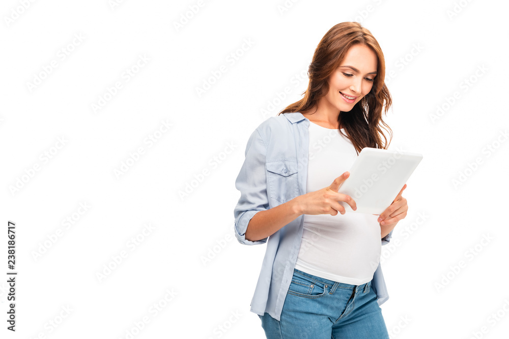 beautiful pregnant woman using digital tablet isolated on white beautiful pregnant woman using digital tablet isolated on white