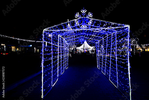 Photography Glowing snowflakes and light stripes on dark, romantic night sky background