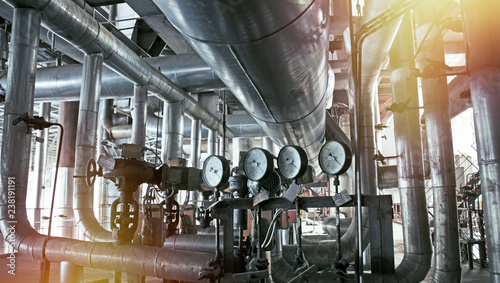 Equipment, cables and piping as found inside of a modern industrial power plant