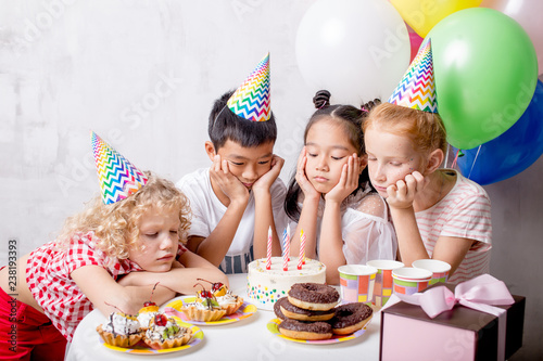 kids are in bad mood during Birthday party. closeup photo. sadness, emotions, feelings concept. close up photo