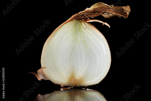slice of fresh ripe raw onion isolated on black