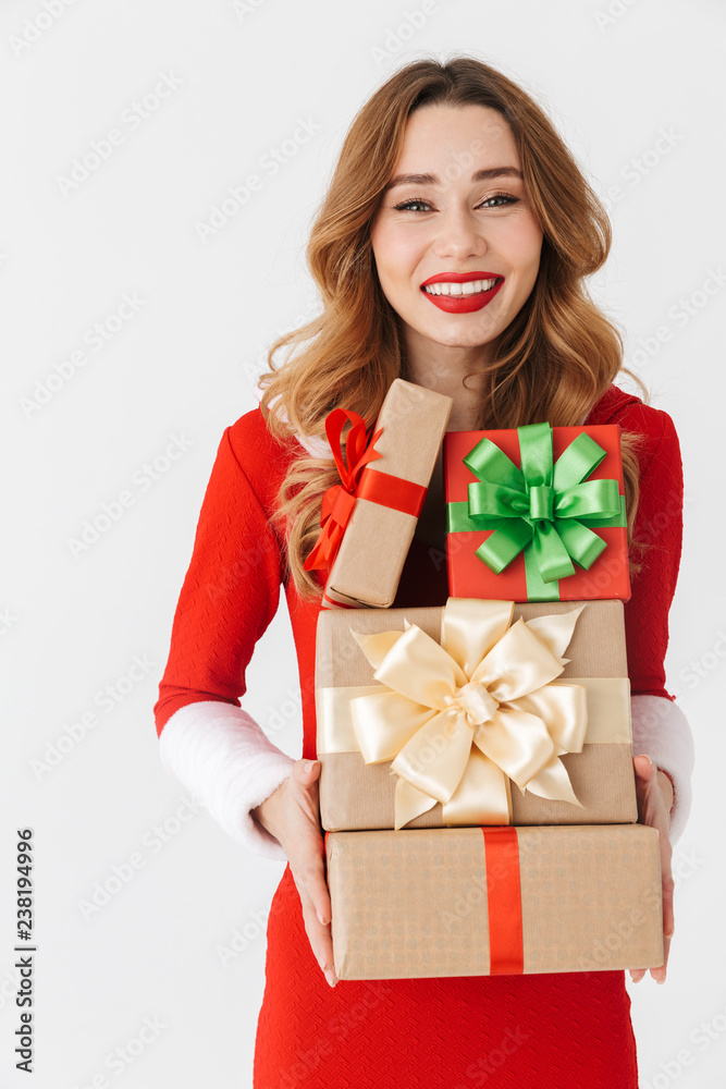 Excited young girl wearing Christmas dress standing Excited young girl wearing Christmas dress standing