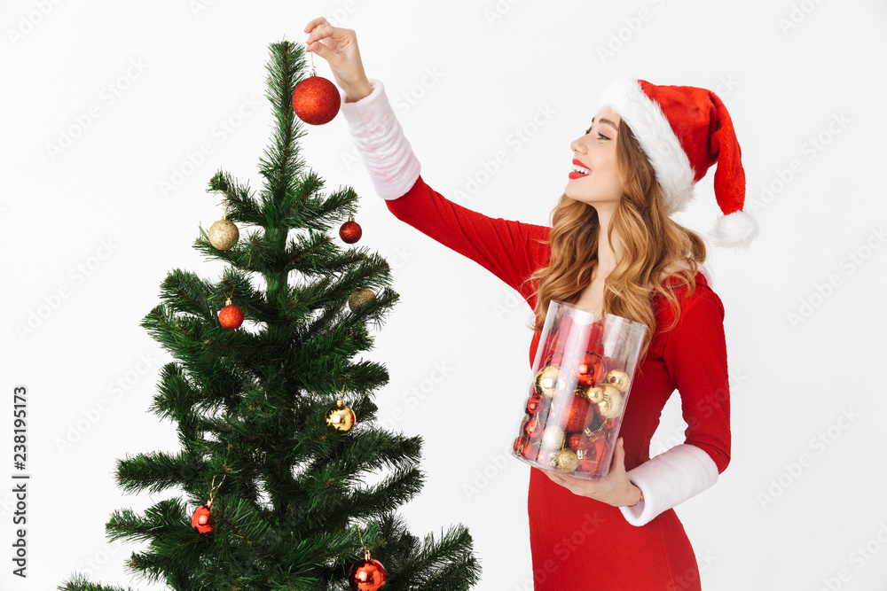 Beautiful excited young girl wearing Christmas dress