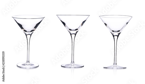 Three empty martini glasses isolated on white background