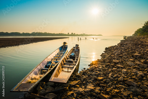 Fishing boat and sunrise in river