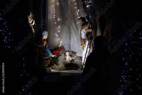Fototapeta Christmas Nativity scene in the church, virgin Mary and Saint Joseph with Holy i