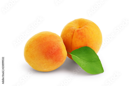 Apricots with leaves  on a white background