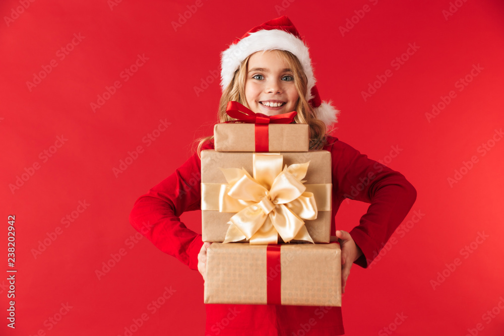 Pretty little girl wearing Christmas hat standing Pretty little girl wearing Christmas hat standing