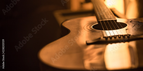 Fényképezés acoustic guitar close-up on a beautiful colored background