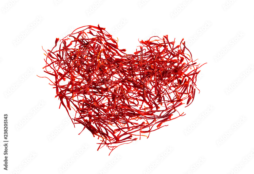 Naklejka premium Saffron's silhouette of the heart. Delicate saffron threads, plucked from crocus flowers and dried. Isolated on white background