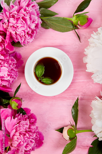 Bouquet Peony flowers and cup of coffee