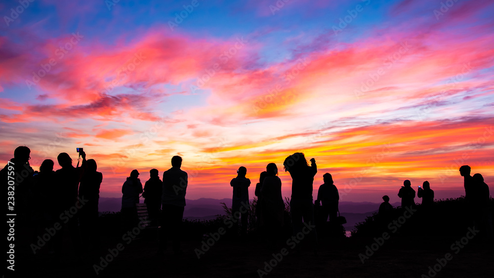 Silhouette of people with sunset.