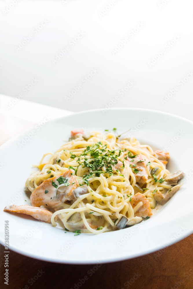 tasty pasta with salmon on a the table